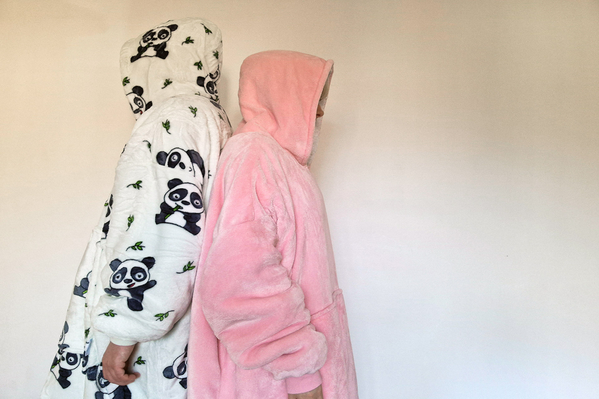 two people wearing oodies
